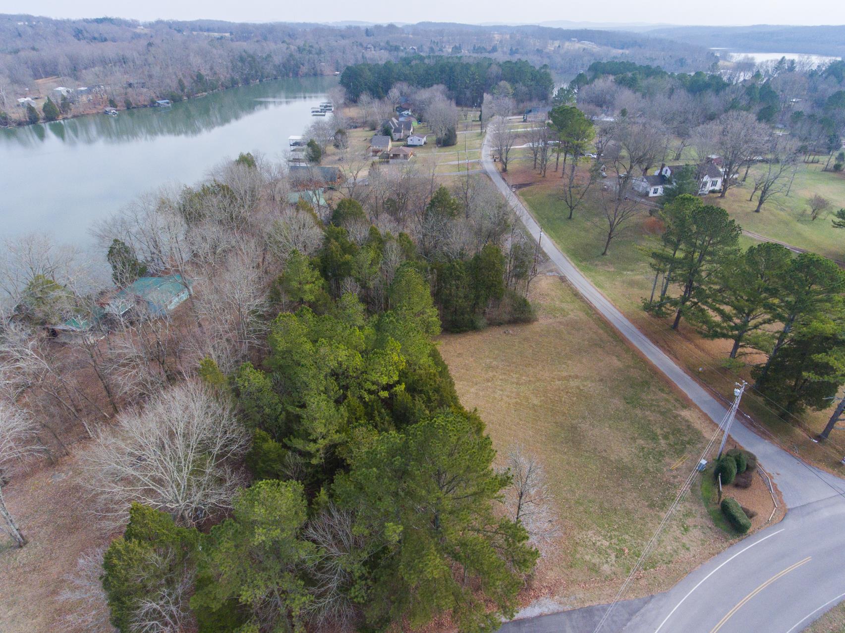 703 Pebble Point Road Lebanon, TN 37087 - Photo 4 of 21 a view of a lake with a mountain in the background