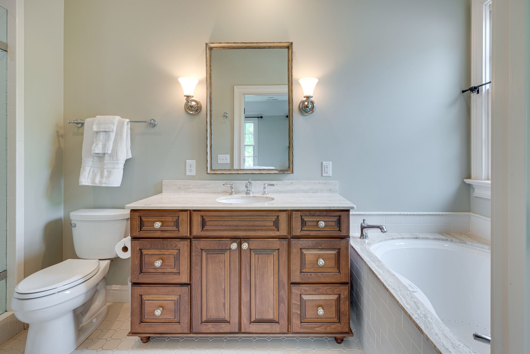 3816 Trimble Road Nashville, TN 37215 - Photo 19 of 26 a bathroom with a sink a toilet and mirror