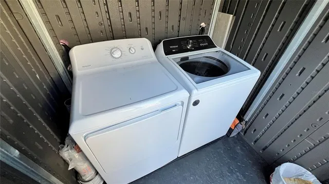 a utility room with dryer and washer