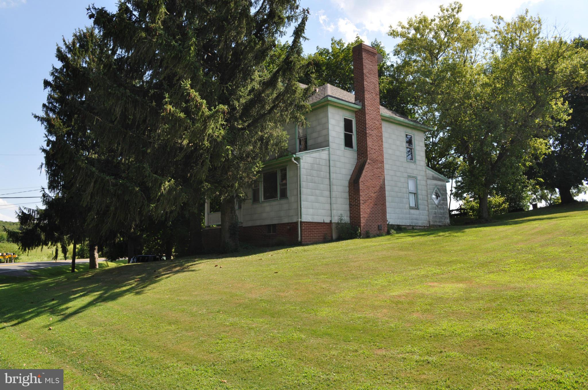 5022 Grand Valley Road Westminster, MD 21158 - Photo 3 of 12 a front view of house with yard and trees