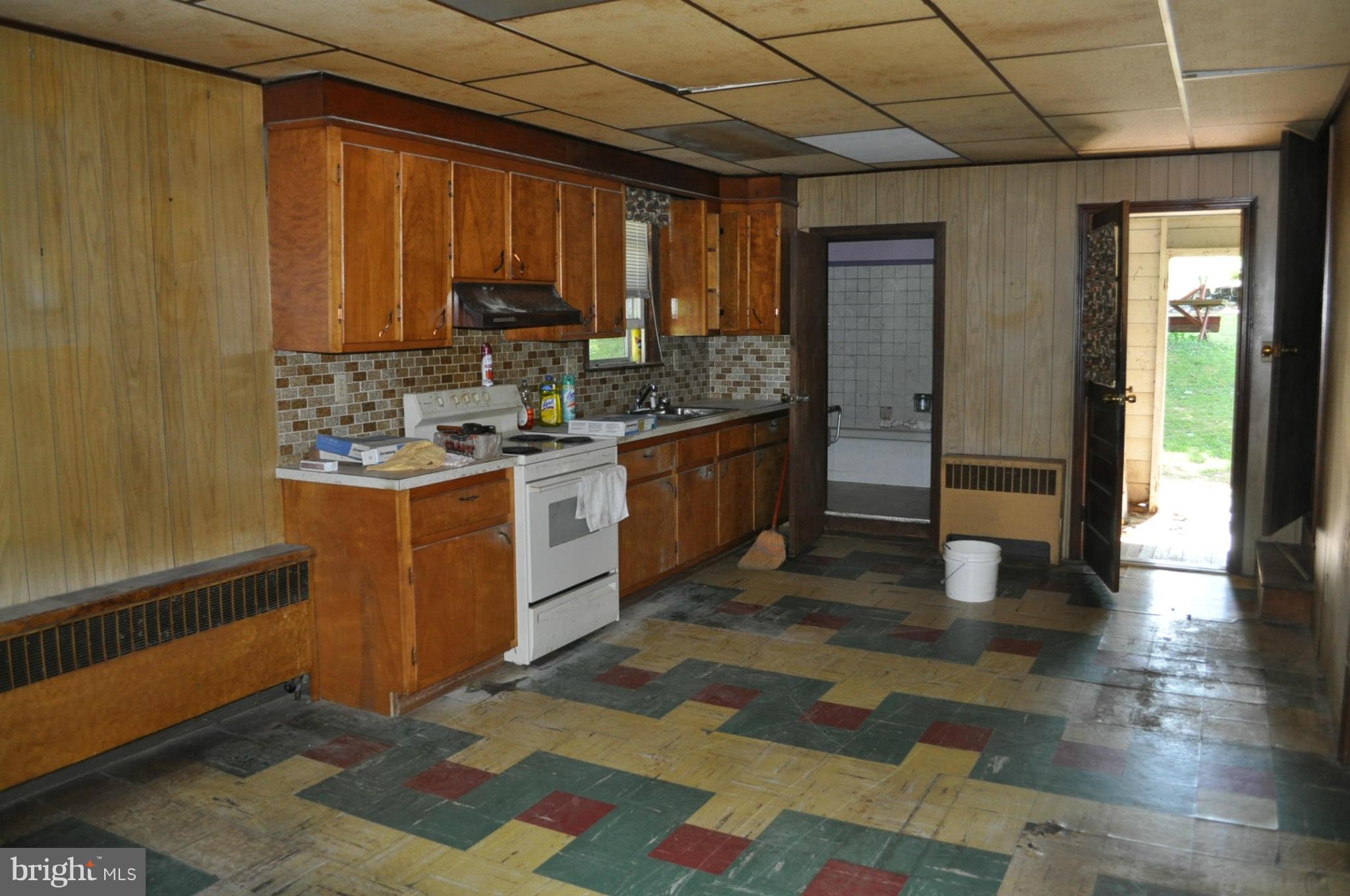 5022 Grand Valley Road Westminster, MD 21158 - Photo 10 of 12 a kitchen with stainless steel appliances granite countertop a stove a sink and a refrigerator