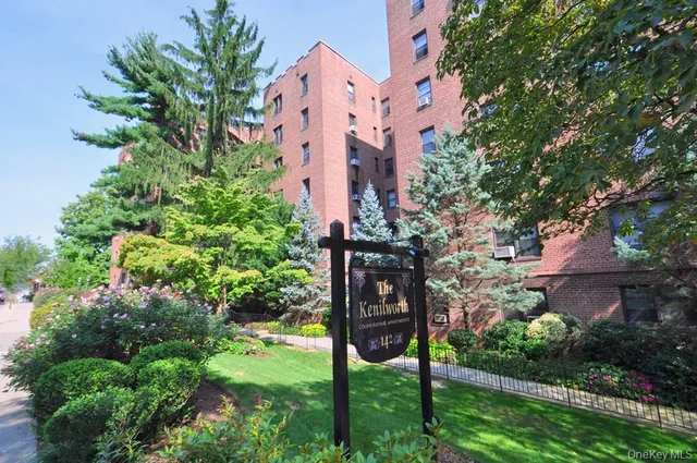 an aerial view of a house with a yard and garden