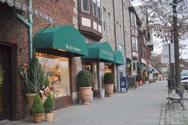a view of a street with sitting area
