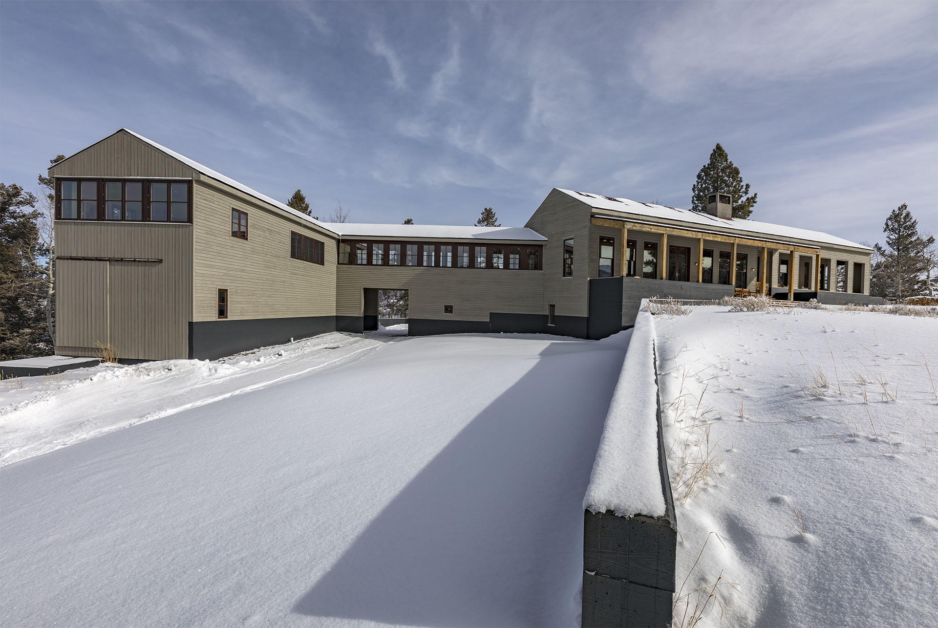 700 Elk Crossing Road Placerville, CO 81430 - Photo 15 of 37 a big house with large windows and wooden stairs