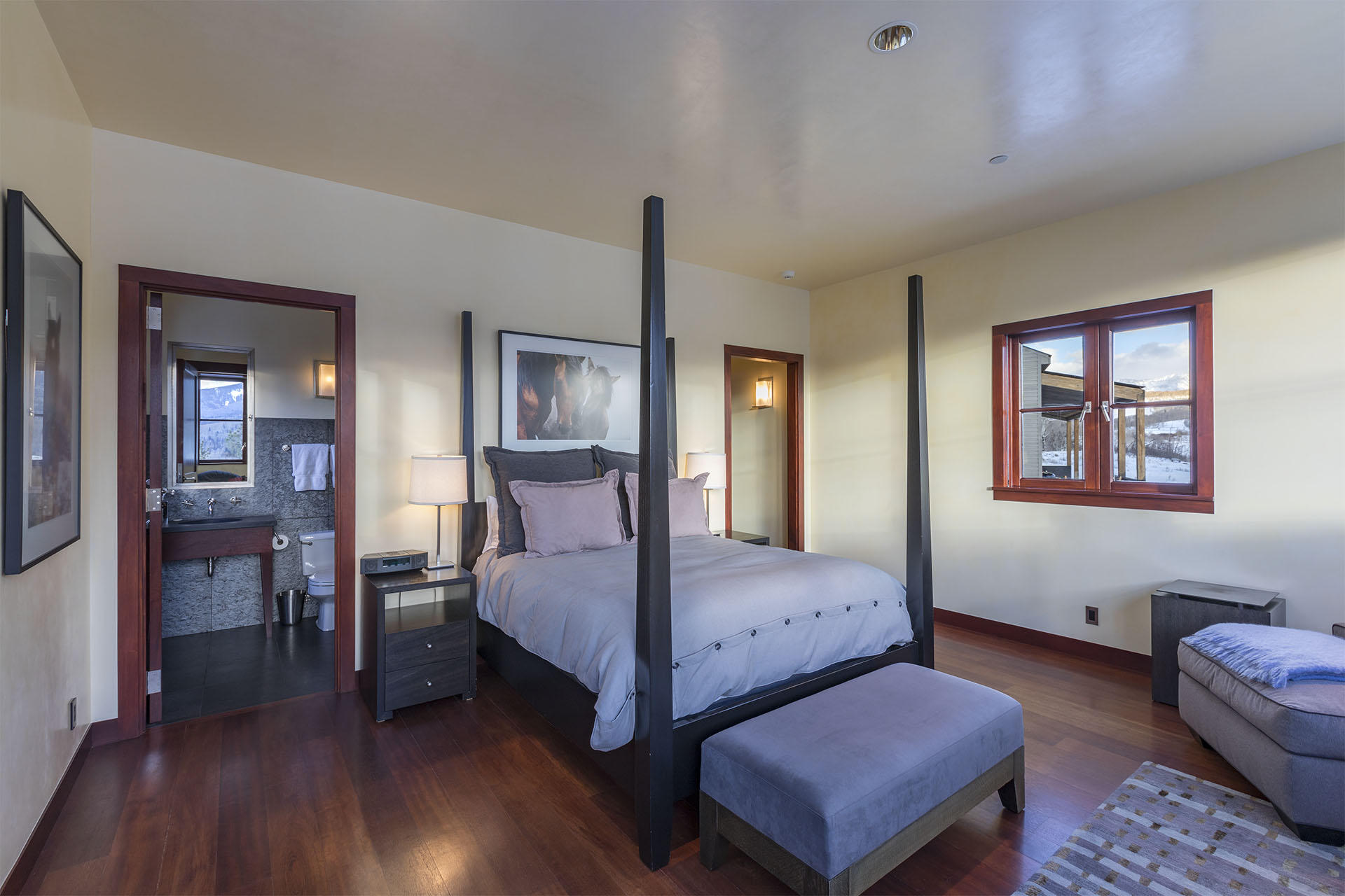 700 Elk Crossing Road Placerville, CO 81430 - Photo 23 of 37 a bedroom with a bed and wooden floor