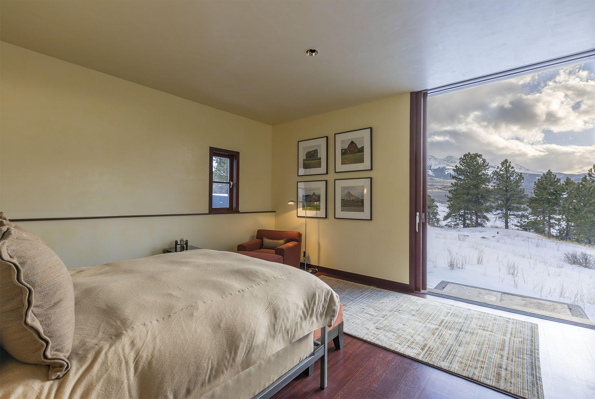700 Elk Crossing Road Placerville, CO 81430 - Photo 32 of 37 a bedroom with a bed and a large window