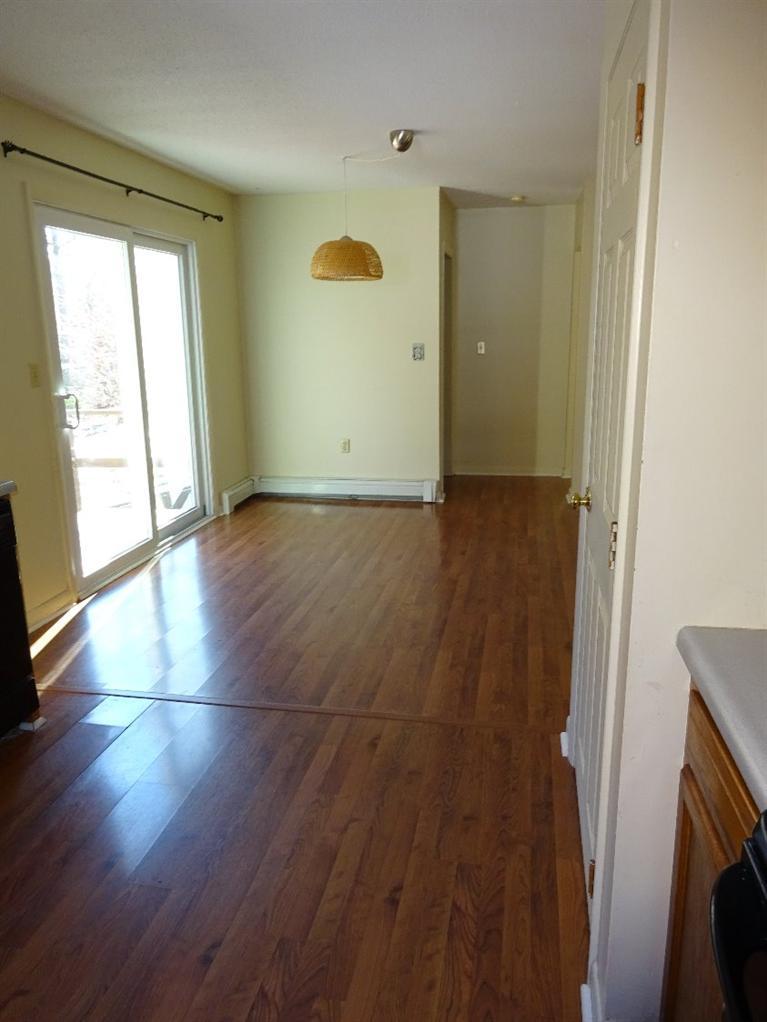 2 Lord Hayford Road Buzzards Bay, MA 02532 - Photo 16 of 16 an empty room with wooden floor and windows