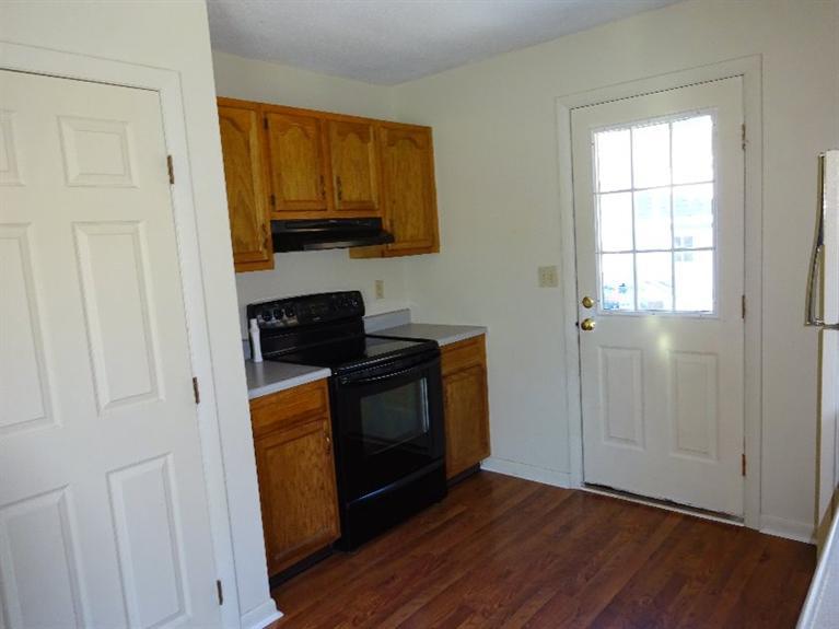 2 Lord Hayford Road Buzzards Bay, MA 02532 - Photo 6 of 16 a kitchen with stainless steel appliances granite countertop a stove a microwave and a refrigerator