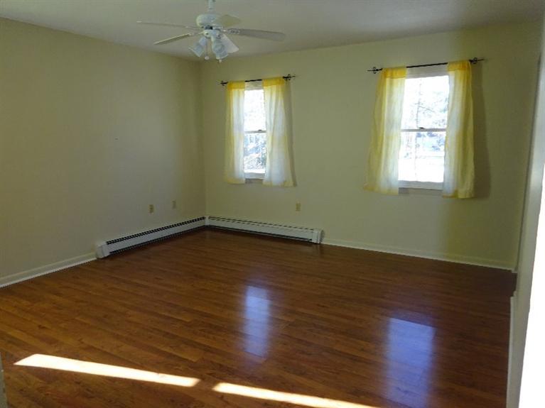 2 Lord Hayford Road Buzzards Bay, MA 02532 - Photo 8 of 16 a view of a room with wooden floor and windows
