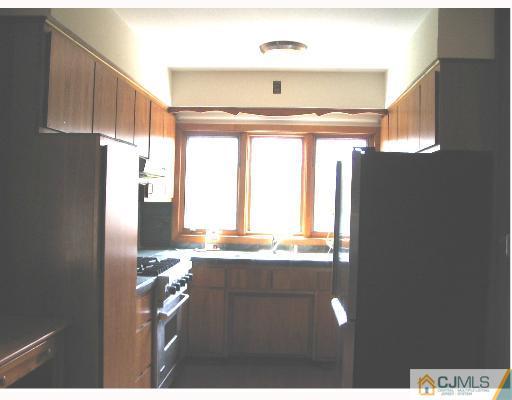 176 Washington Road Sayreville, NJ 08872 - Photo 4 of 8 a view of kitchen with granite countertop cabinets and outdoor space