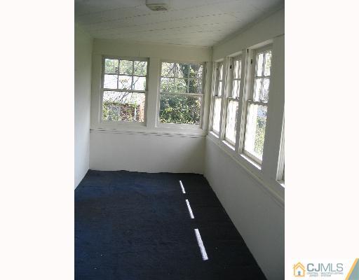 176 Washington Road Sayreville, NJ 08872 - Photo 6 of 8 a view of an empty room with a window