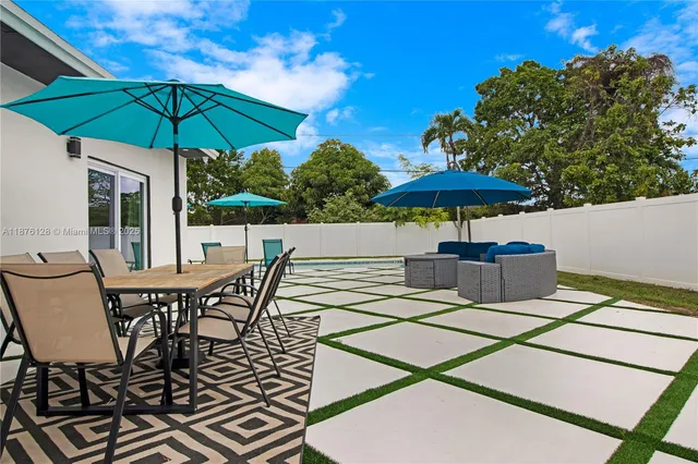 a view of a swimming pool with a patio