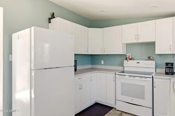 a view of living room filled with furniture and floor to ceiling window