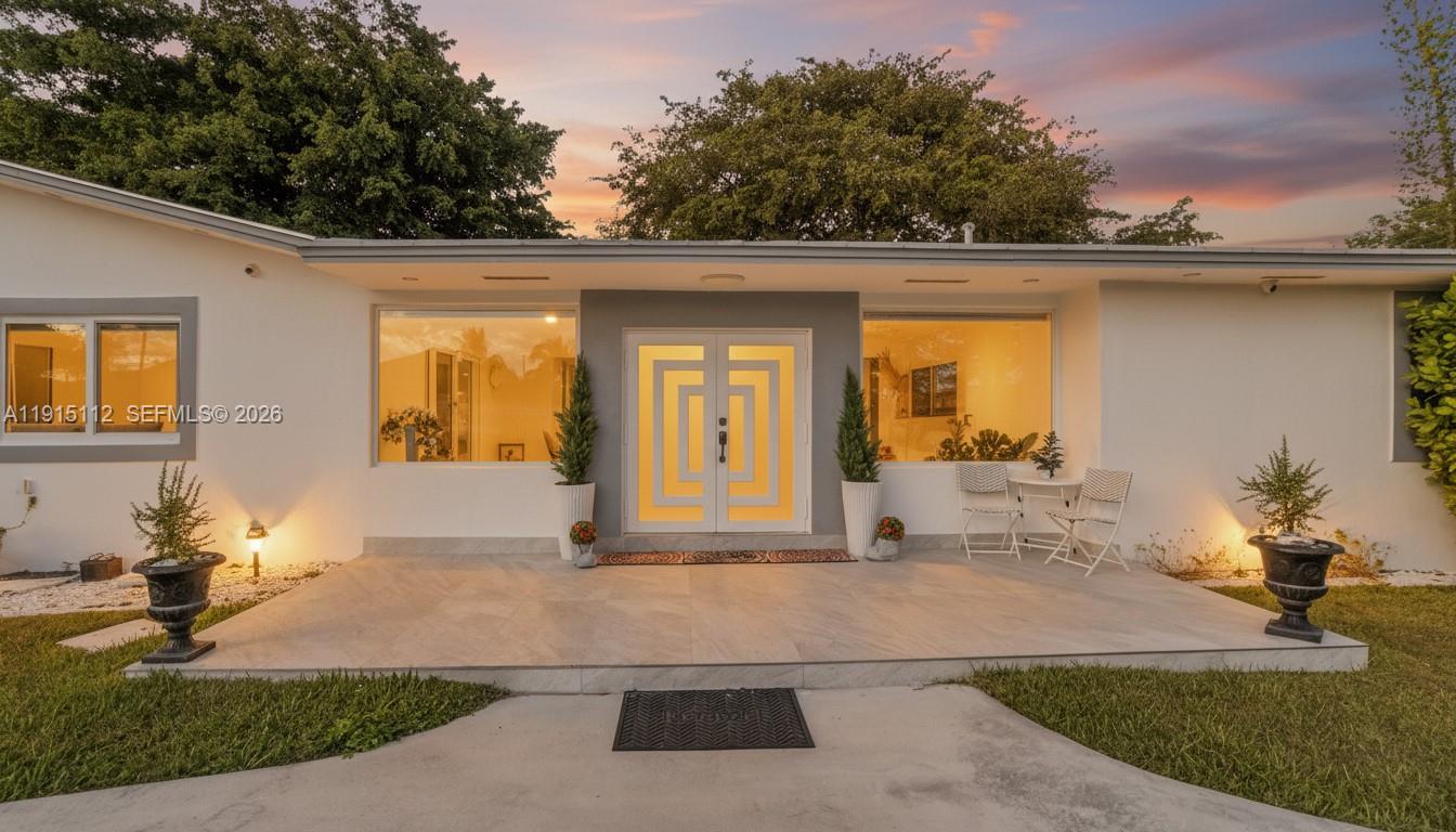 a front view of a house with garden
