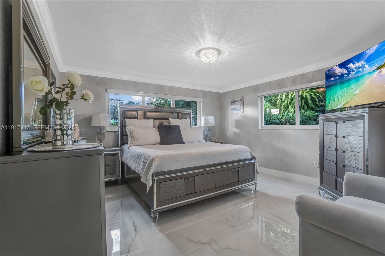 12601 Southwest 204th Street Miami, FL 33177 - Photo 11 of 40 a bedroom with a bed couch and a potted plant