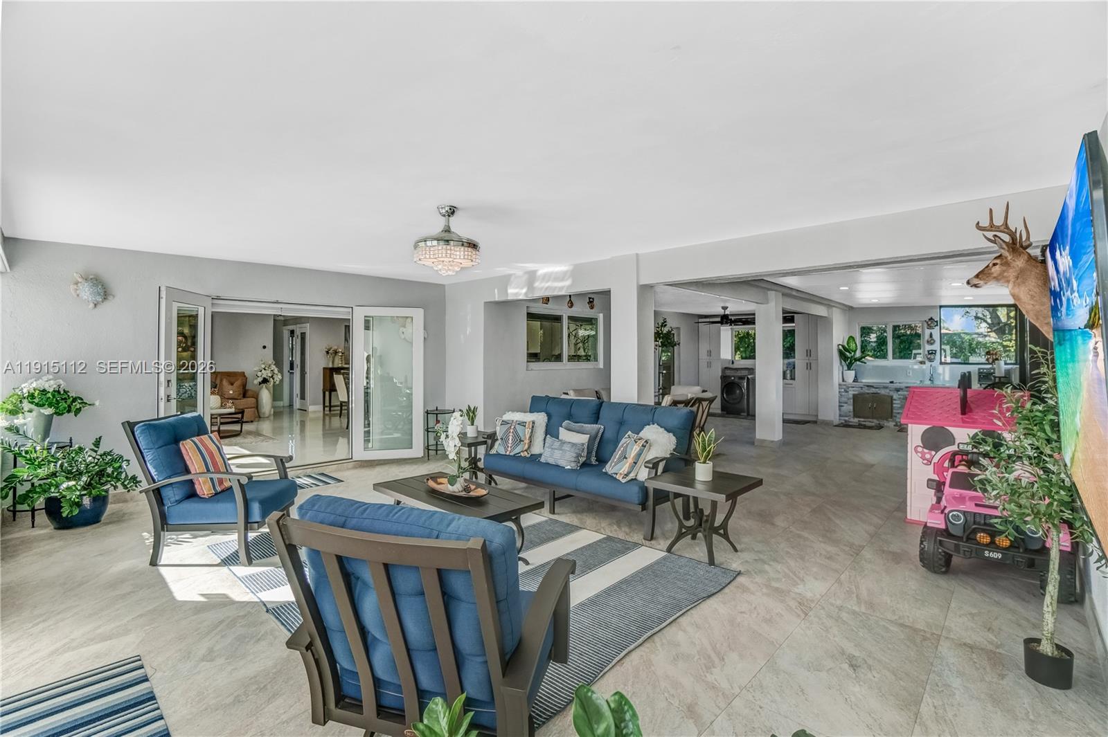 12601 Southwest 204th Street Miami, FL 33177 - Photo 22 of 40 a living room with furniture and a potted plant