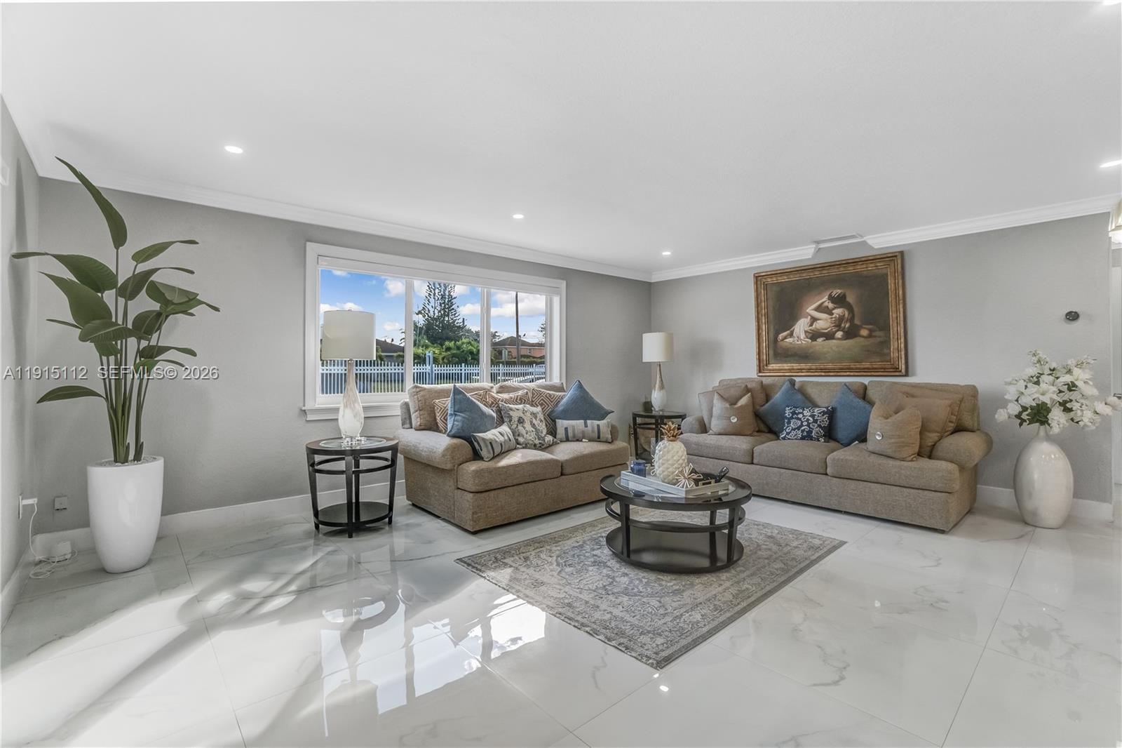 12601 Southwest 204th Street Miami, FL 33177 - Photo 25 of 40 a living room with furniture and a large window