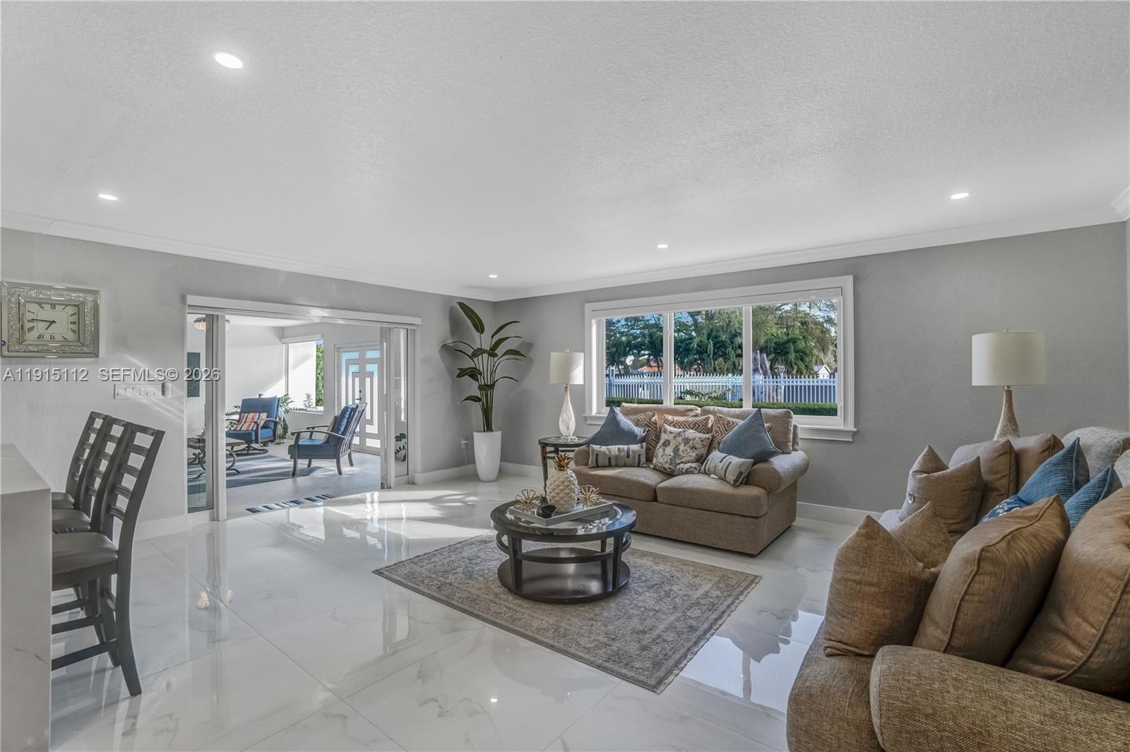 12601 Southwest 204th Street Miami, FL 33177 - Photo 26 of 40 a living room with furniture and wooden floor