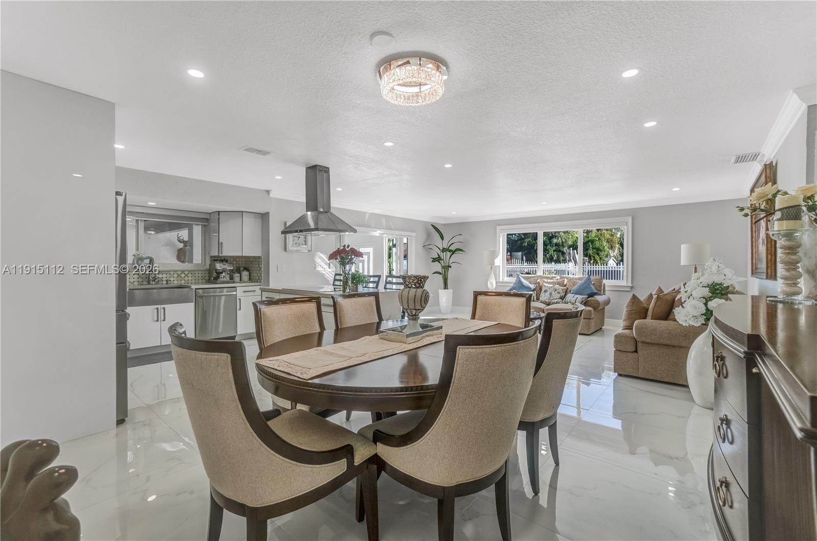 12601 Southwest 204th Street Miami, FL 33177 - Photo 31 of 40 a dining room with furniture and a table