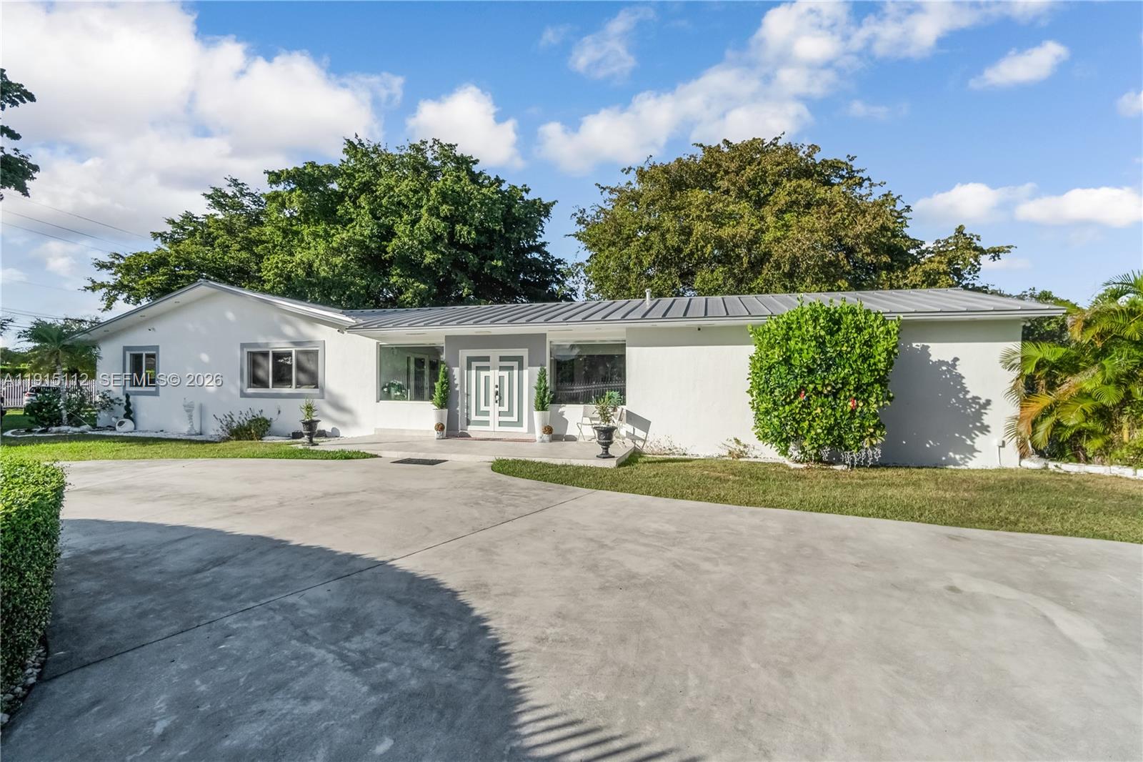 12601 Southwest 204th Street Miami, FL 33177 - Photo 37 of 40 a view of house with outdoor space and swimming pool