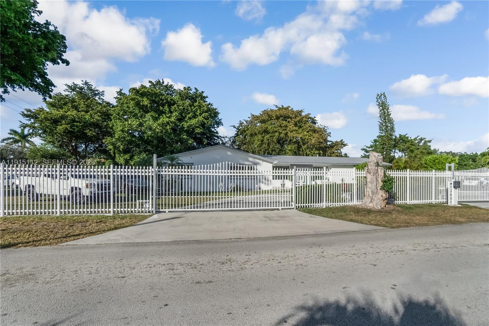 12601 Southwest 204th Street Miami, FL 33177 - Photo 40 of 40 a view of a house with a backyard