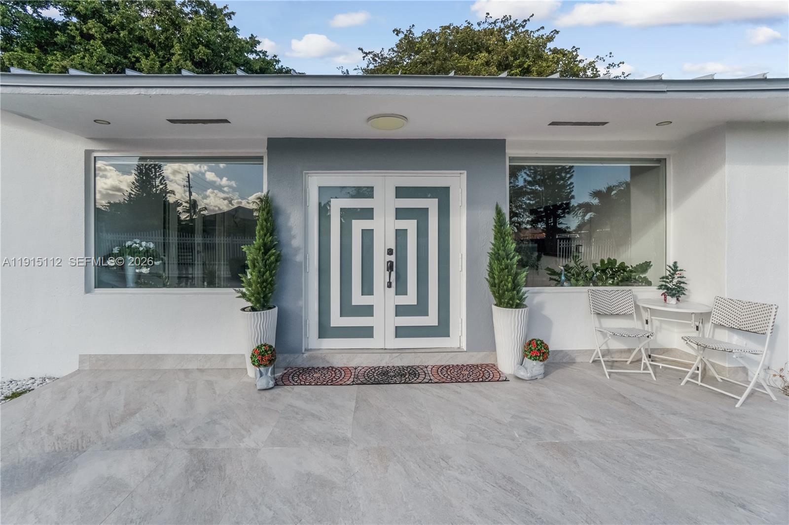12601 Southwest 204th Street Miami, FL 33177 - Photo 4 of 40 a view of a house with a outdoor space
