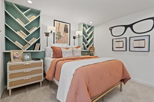 a bed room with a bed and furniture