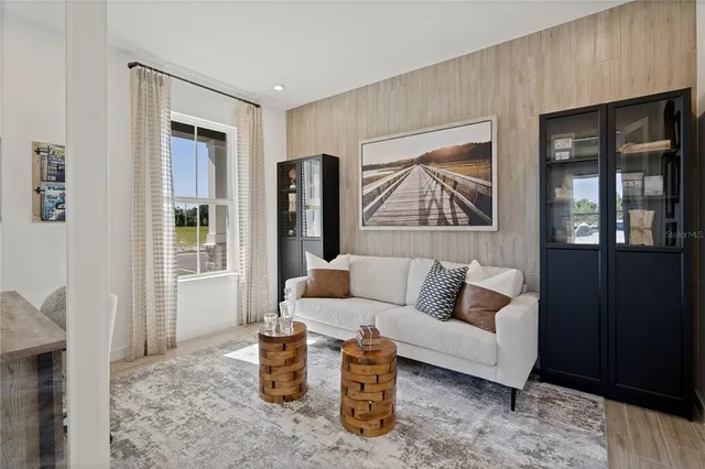 a living room with furniture and window