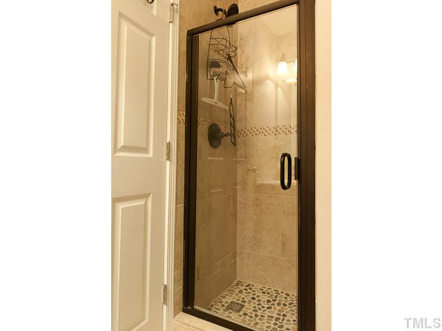 9710 Layla Avenue Raleigh, NC 27617 - Photo 23 of 25 1st floor bathroom. Serves the 1st floor bedroom.