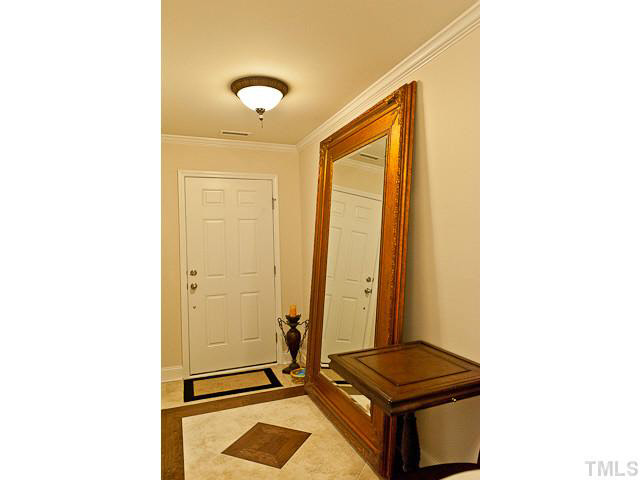 9710 Layla Avenue Raleigh, NC 27617 - Photo 3 of 25 Tile and hardwood entry foyer.