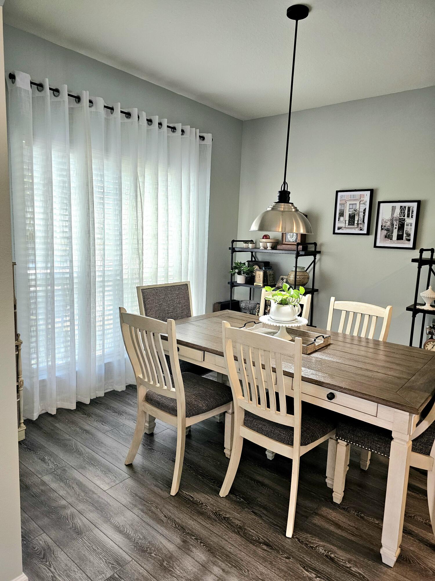 140 Nelly Street Freeport, FL 32439 - Photo 11 of 53 a view of a dining room with furniture window and wooden floor