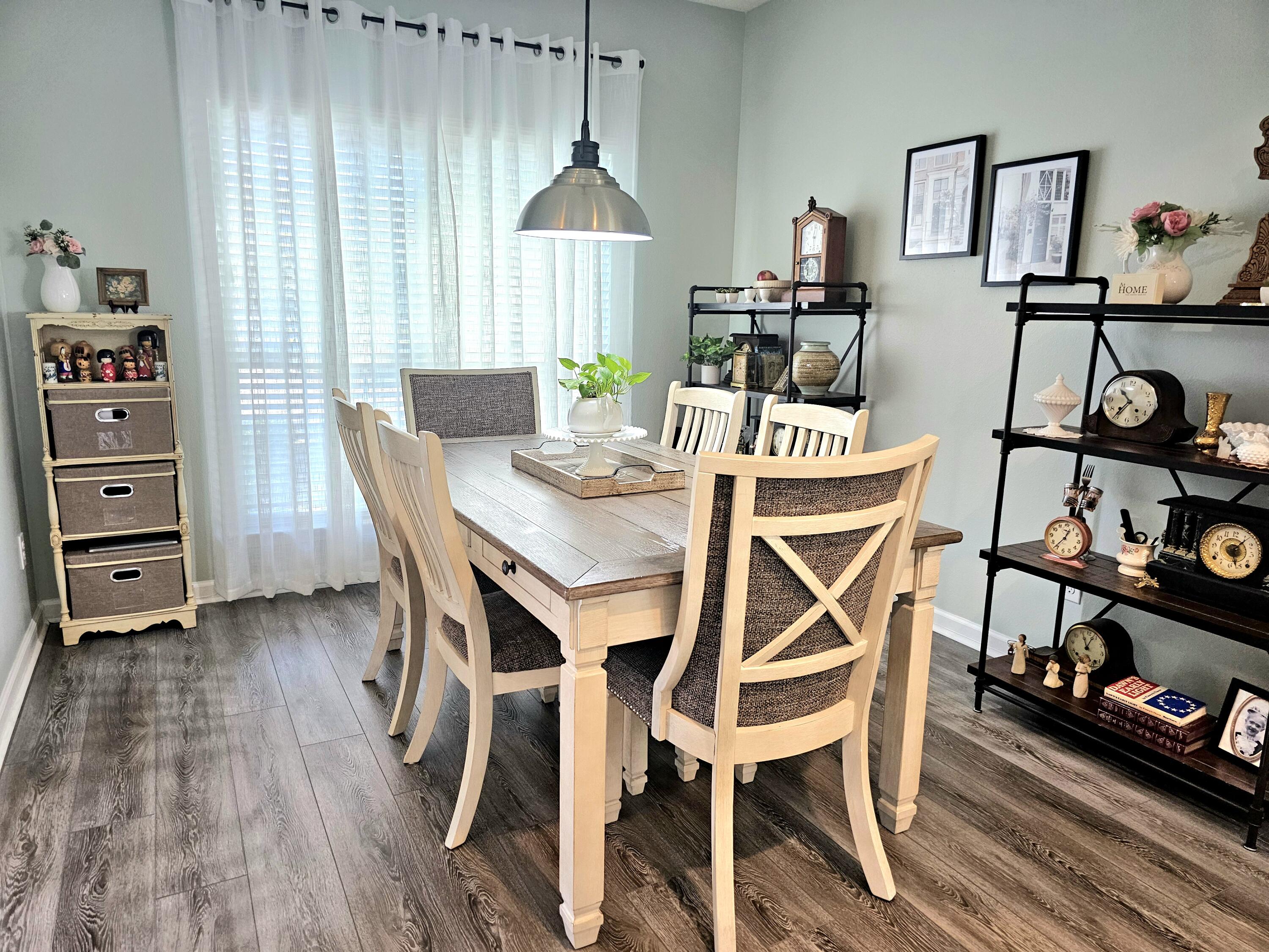 140 Nelly Street Freeport, FL 32439 - Photo 12 of 53 a dining room with furniture and wooden floor