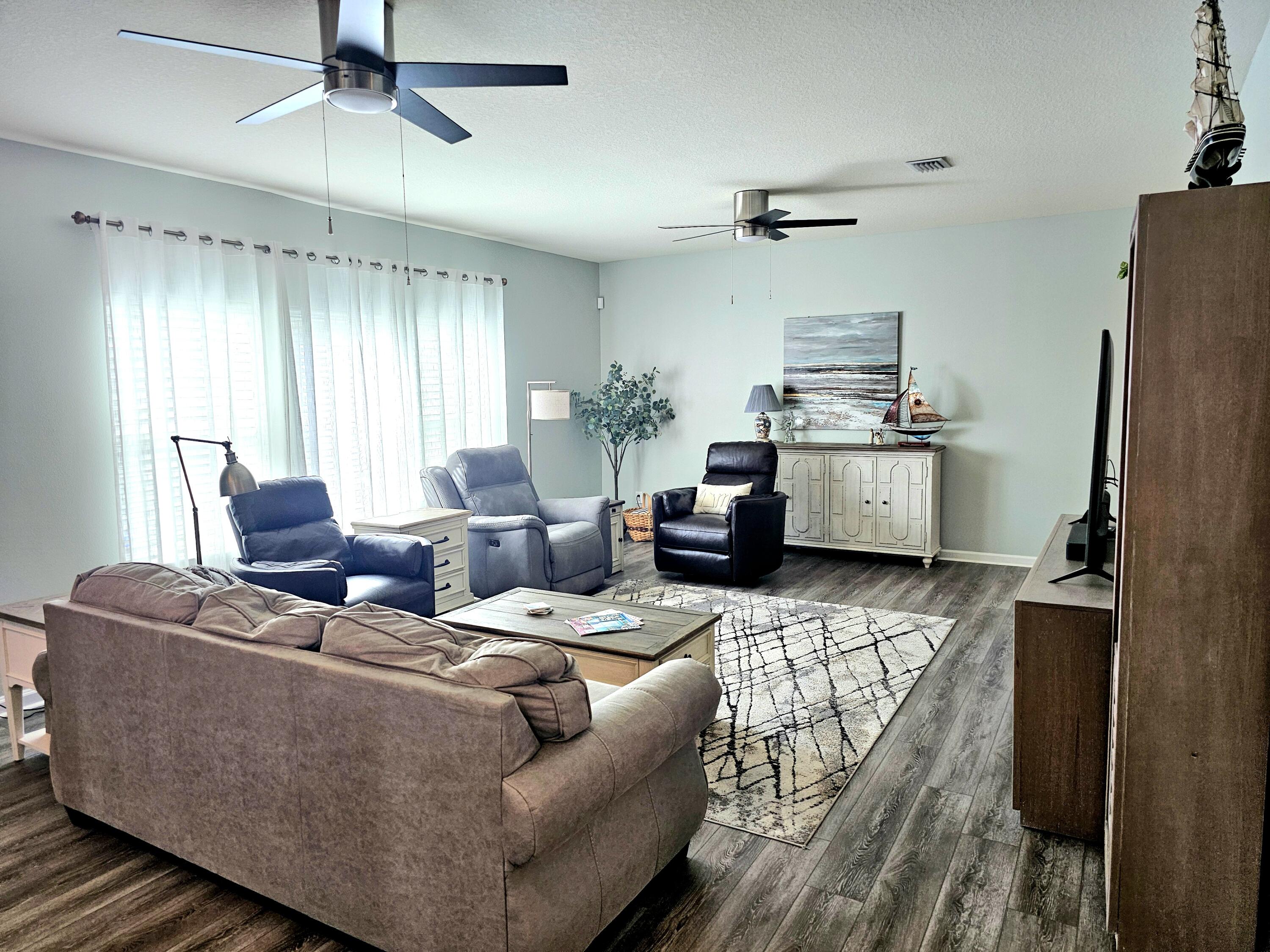 140 Nelly Street Freeport, FL 32439 - Photo 13 of 53 a living room with furniture and a window