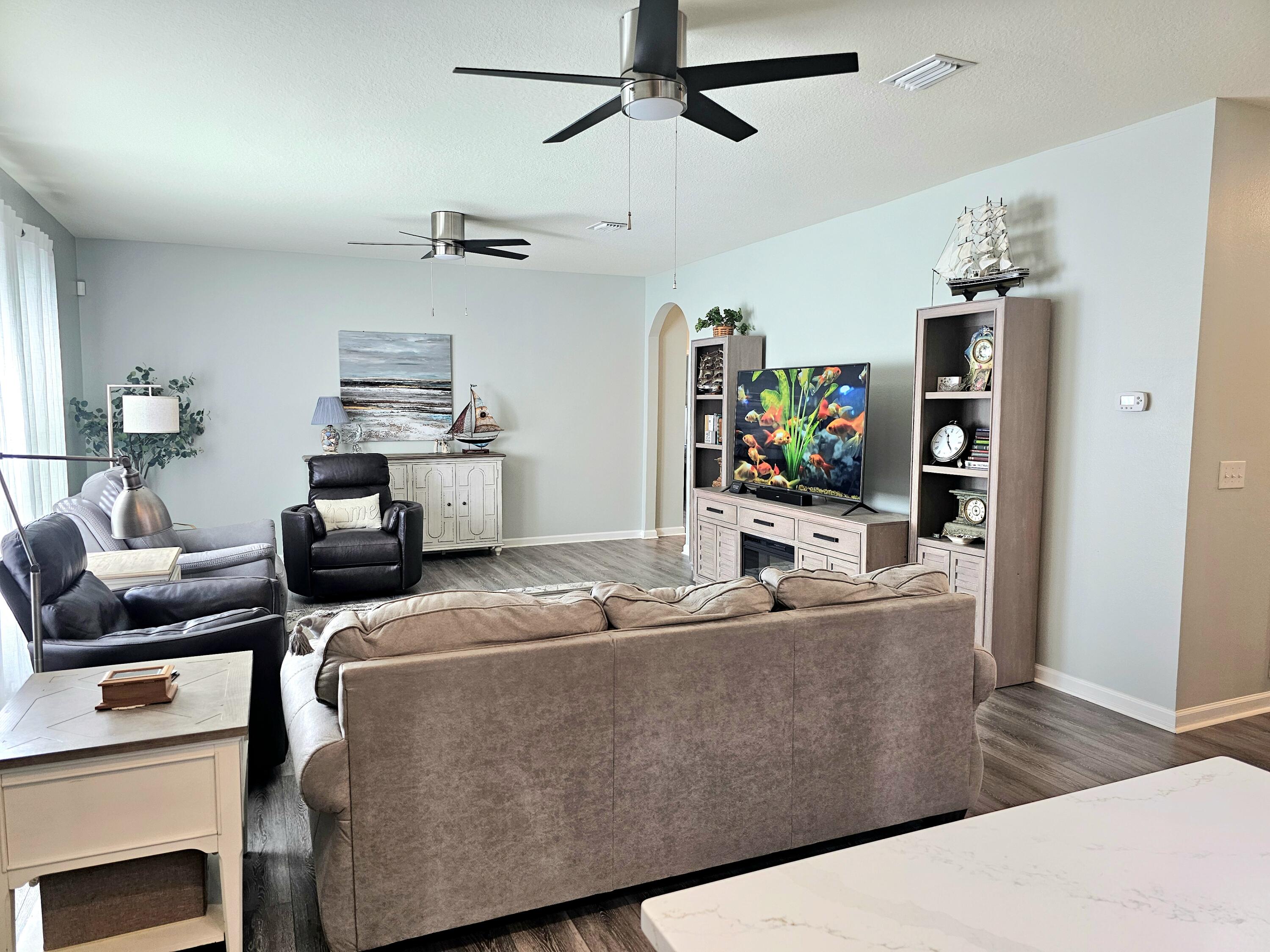 140 Nelly Street Freeport, FL 32439 - Photo 16 of 53 a living room with furniture and flat screen tv