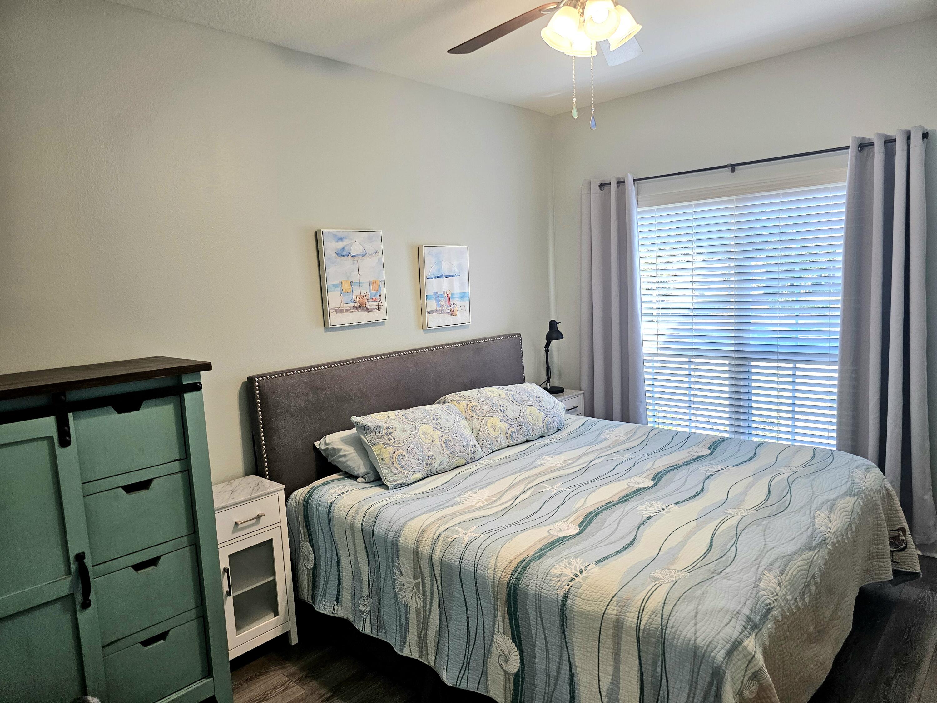 140 Nelly Street Freeport, FL 32439 - Photo 20 of 53 a bedroom with a bed and a window