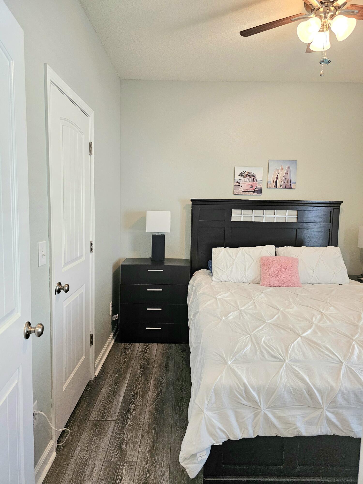 140 Nelly Street Freeport, FL 32439 - Photo 24 of 53 a bedroom with a bed and a chandelier