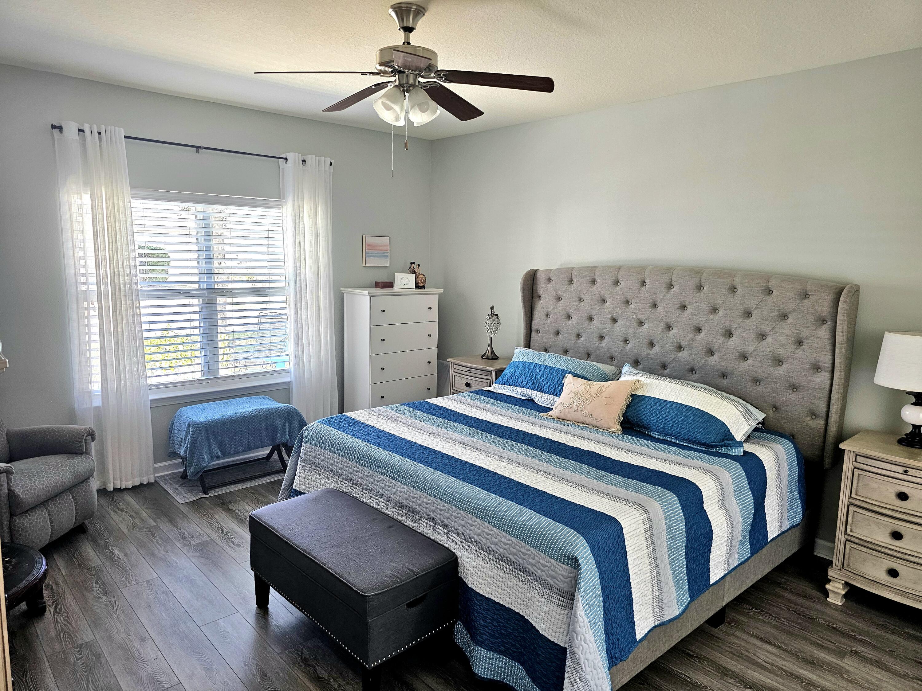 140 Nelly Street Freeport, FL 32439 - Photo 25 of 53 a bedroom with a bed and a couch