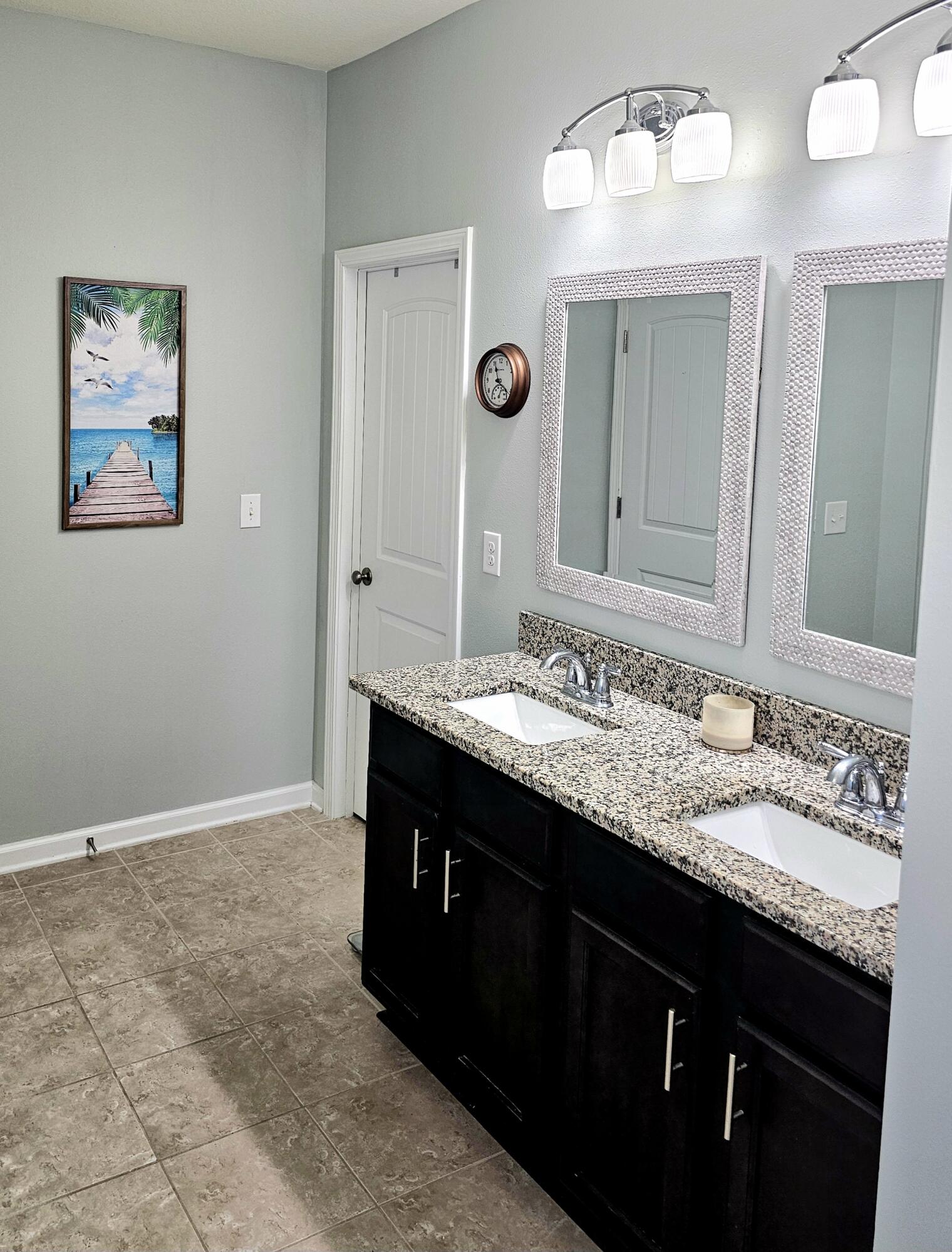 140 Nelly Street Freeport, FL 32439 - Photo 29 of 53 a bathroom with double sink and a mirror