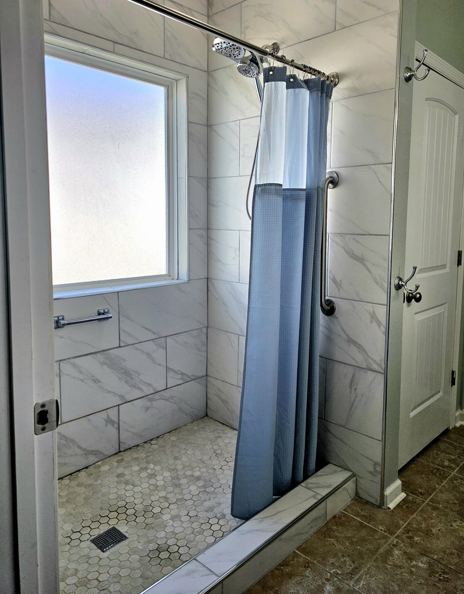140 Nelly Street Freeport, FL 32439 - Photo 30 of 53 a bathroom with a shower