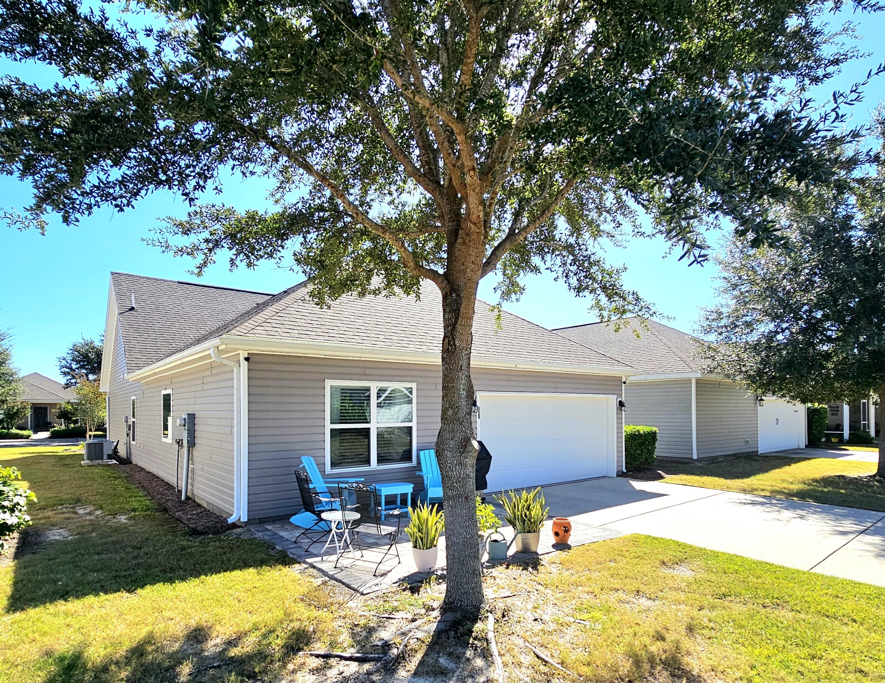 140 Nelly Street Freeport, FL 32439 - Photo 34 of 53 a view of a house with swimming pool and sitting area