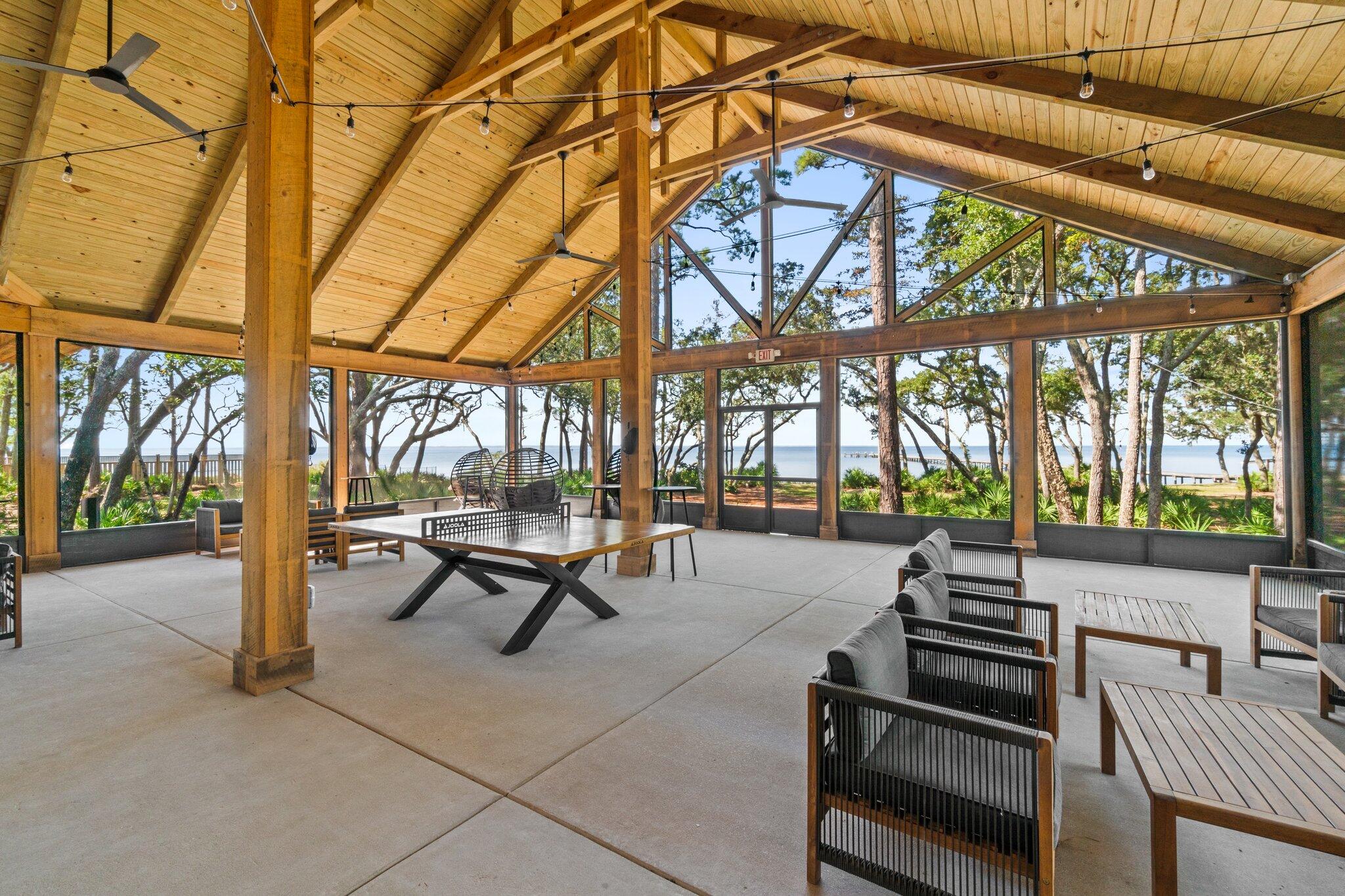 140 Nelly Street Freeport, FL 32439 - Photo 47 of 53 a building outdoor space with patio furniture and a potted plant