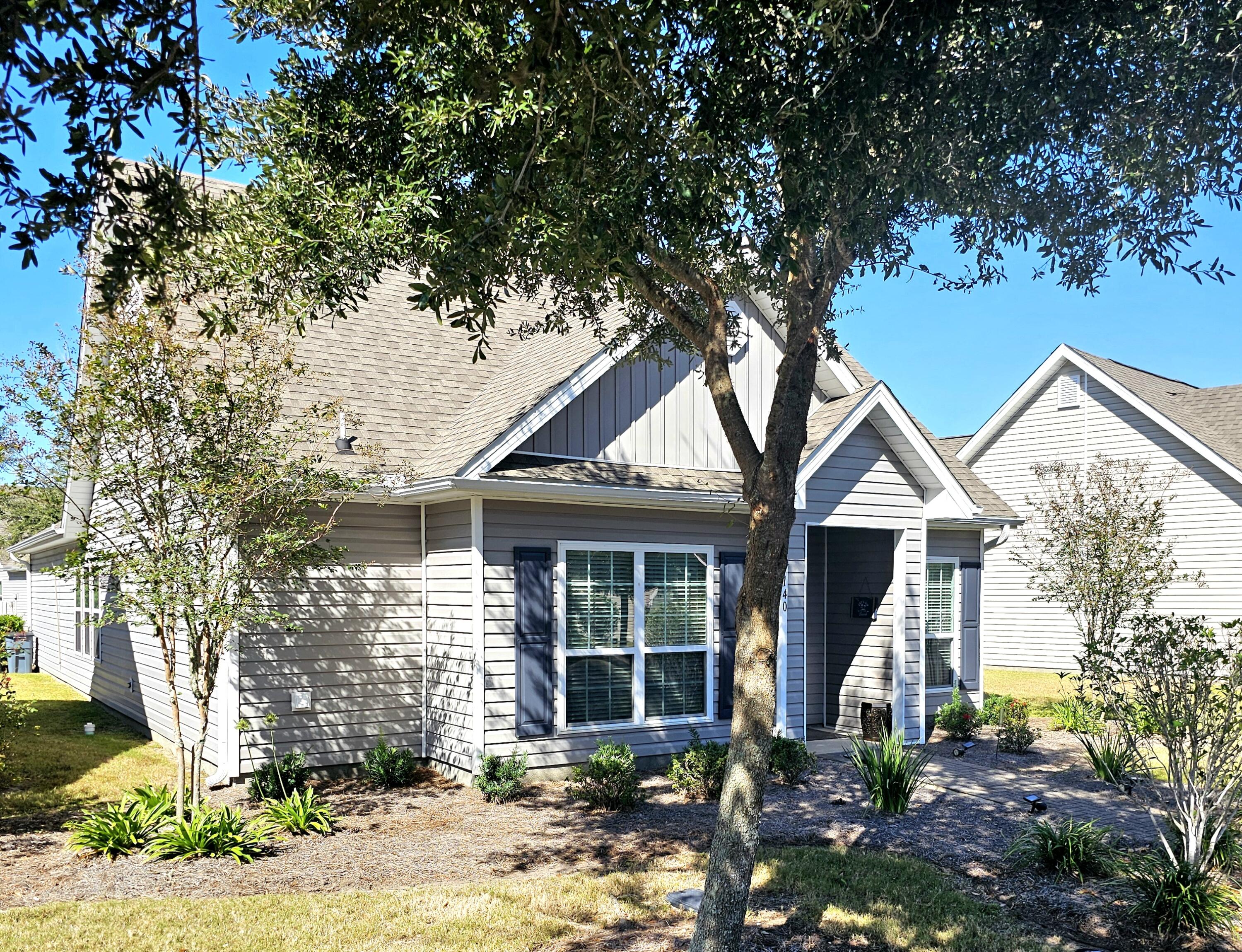 140 Nelly Street Freeport, FL 32439 - Photo 5 of 53 a front view of a house with garden