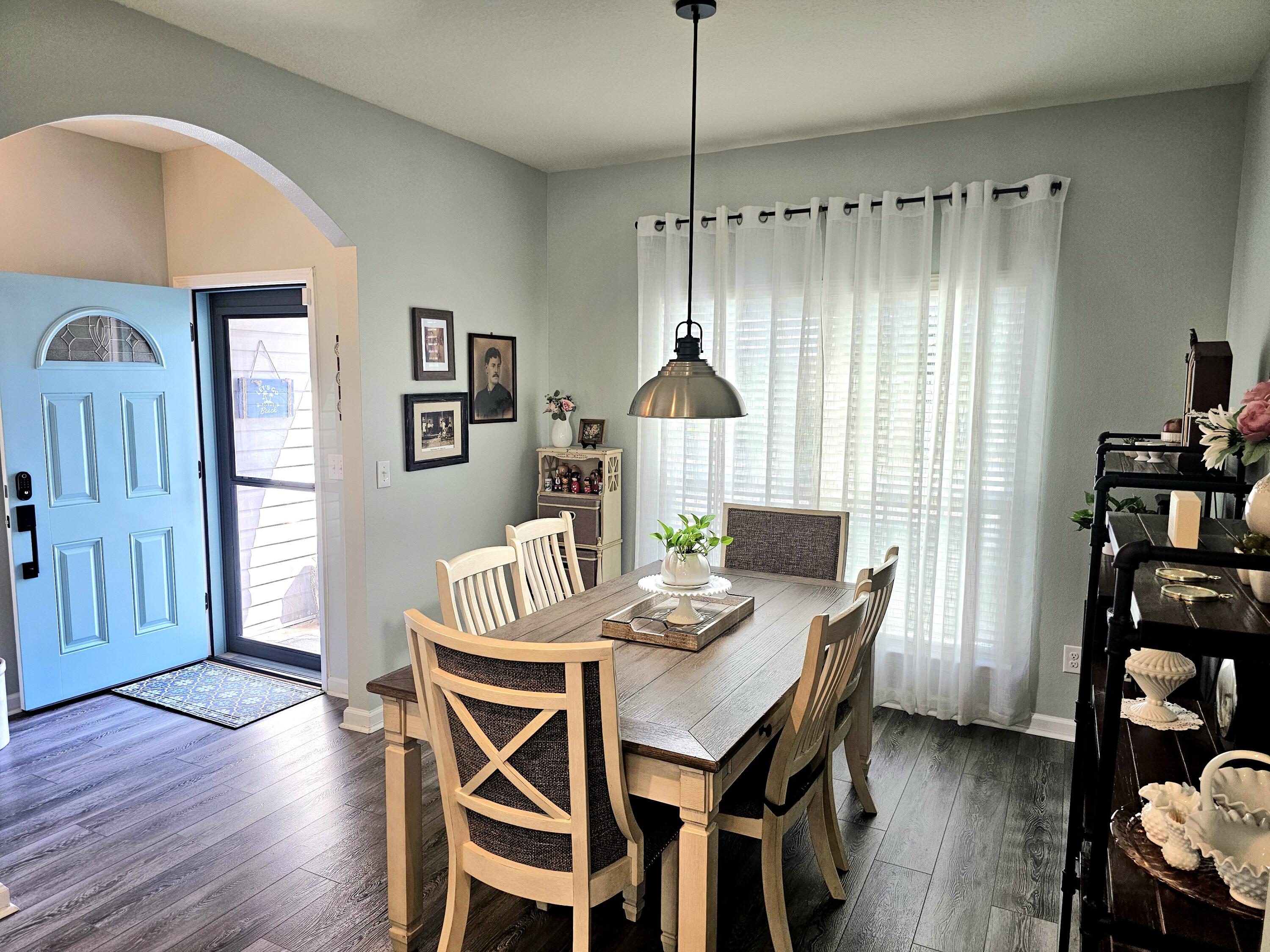 140 Nelly Street Freeport, FL 32439 - Photo 9 of 53 a view of a dining room with furniture window and wooden floor