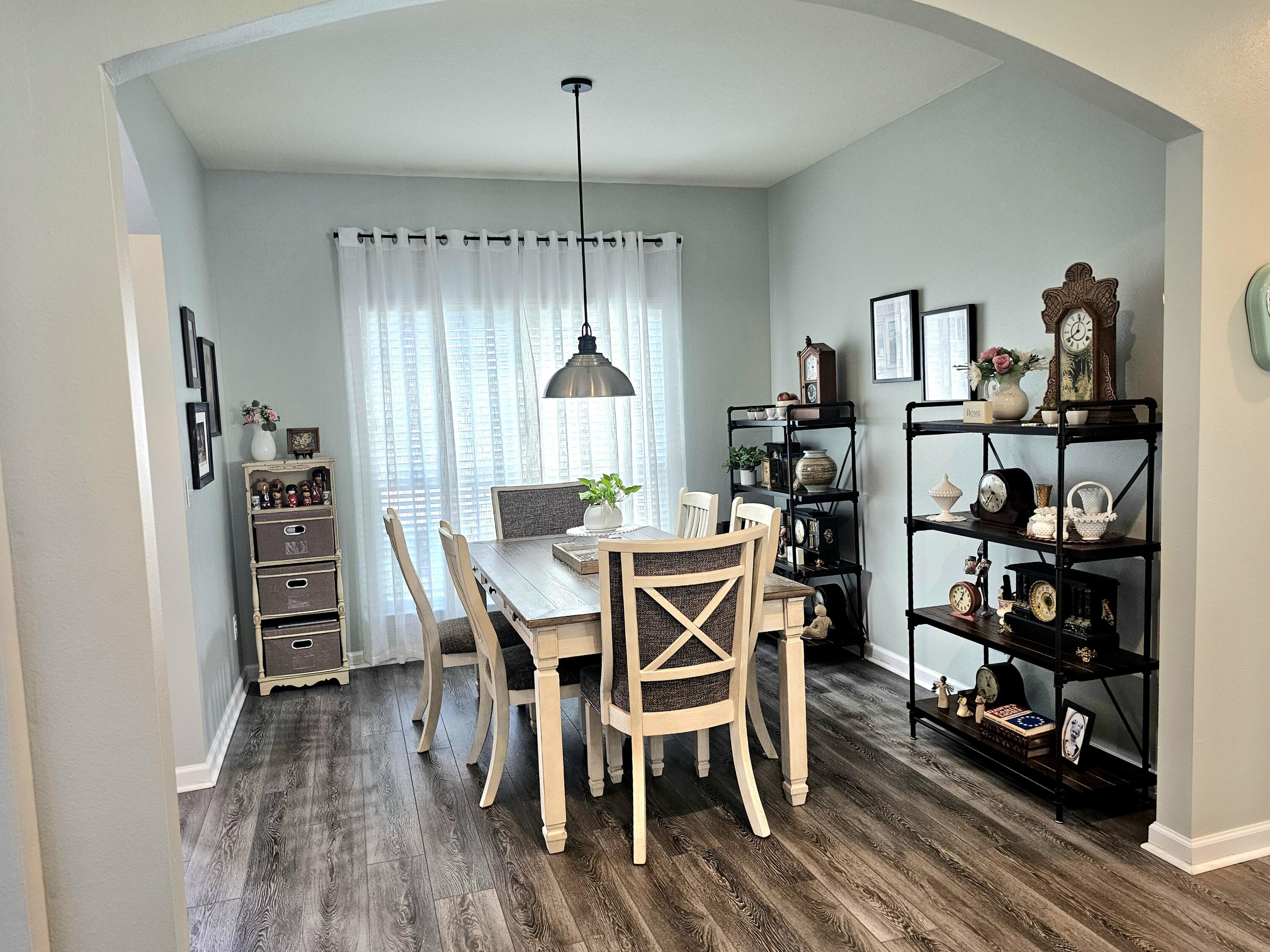 140 Nelly Street Freeport, FL 32439 - Photo 10 of 53 a view of a dining room with furniture and wooden floor
