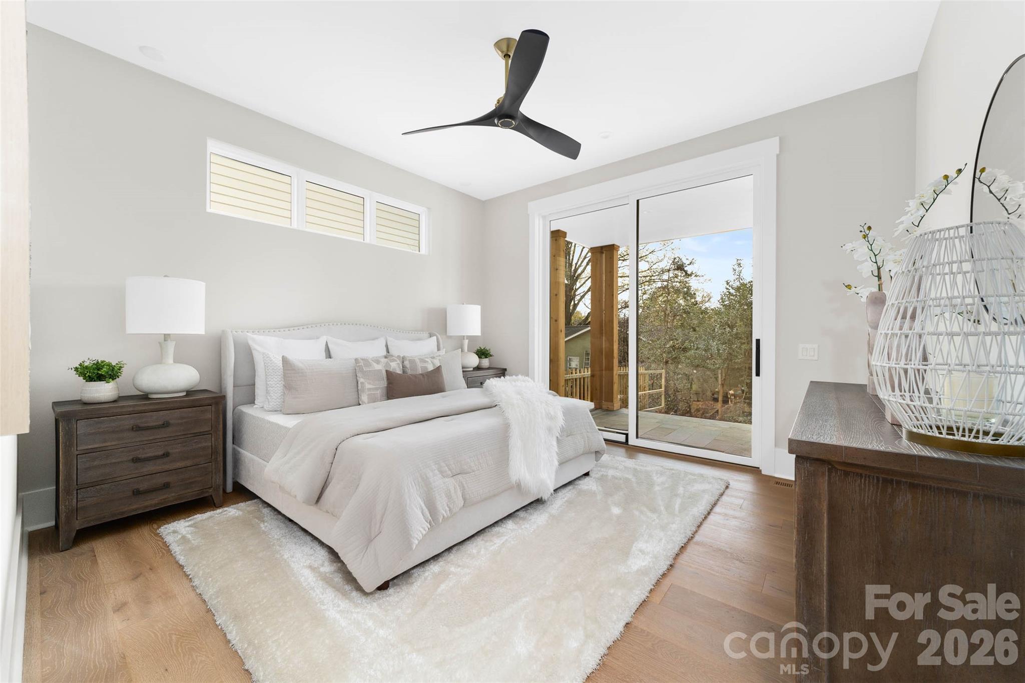 216 Walnut Street Davidson, NC 28036 - Photo 18 of 48 a spacious bedroom with a bed and a window