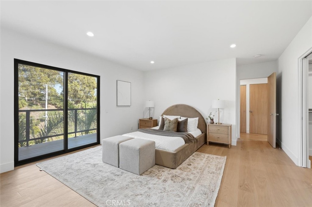 8140 Calabar Avenue Playa del Rey, CA 90293 - Photo 26 of 60 a spacious bedroom with a large bed and a large window
