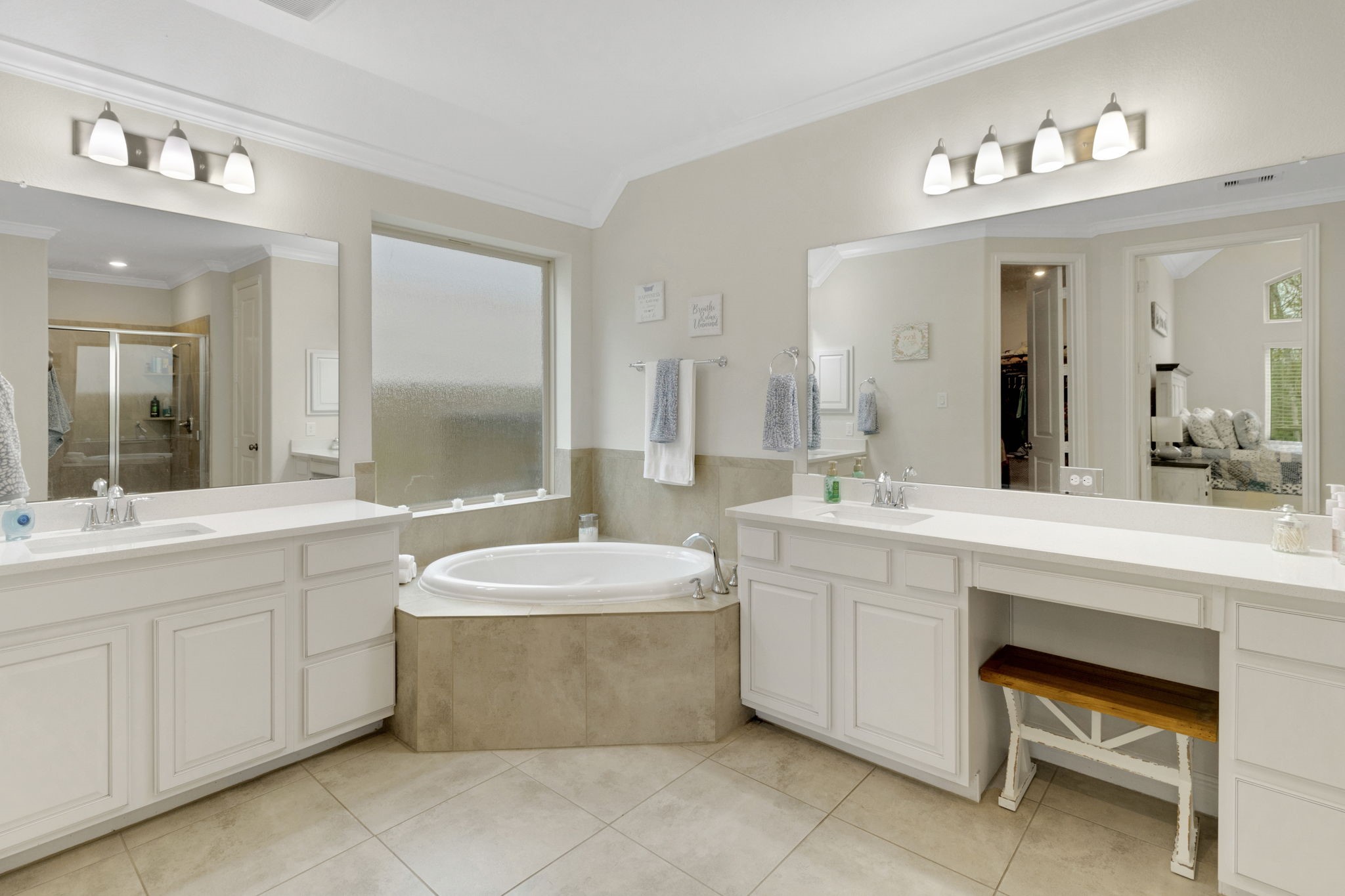 19248 Yellow Chestnut Lane New Caney, TX 77357 - Photo 14 of 42 a spacious bathroom with a double vanity sink mirror and bathtub