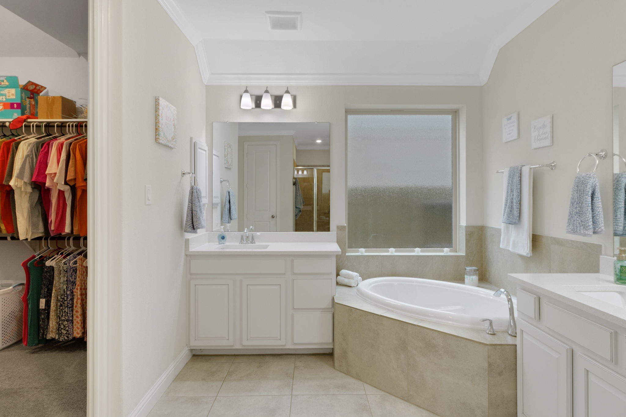 19248 Yellow Chestnut Lane New Caney, TX 77357 - Photo 17 of 42 a bathroom with a tub sink and mirror