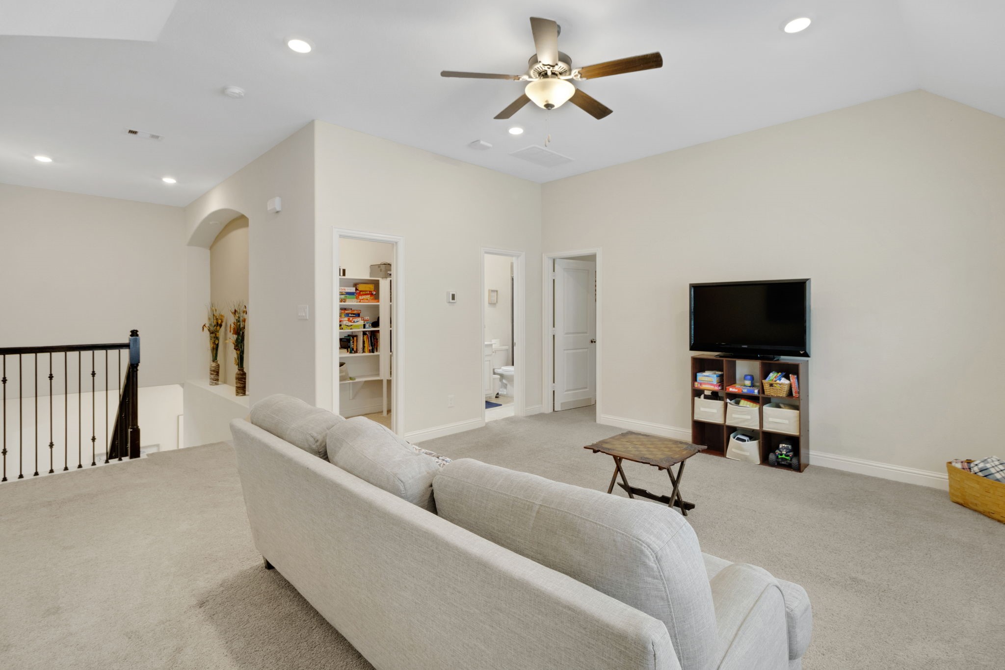 19248 Yellow Chestnut Lane New Caney, TX 77357 - Photo 21 of 42 a living room with furniture and a flat screen tv