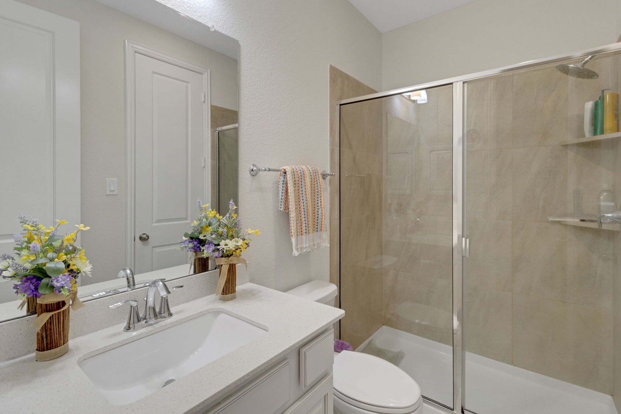 19248 Yellow Chestnut Lane New Caney, TX 77357 - Photo 26 of 42 a bathroom with a sink toilet and shower